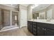 Bathroom with double sink vanity, a walk-in shower, and tiled floor at 109 Hammermill Dr, Fuquay Varina, NC 27526