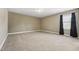 Bedroom with carpet, neutral walls, and single window with black-out curtains at 109 Hammermill Dr, Fuquay Varina, NC 27526