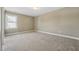 Spacious bedroom with plush carpet, ample natural light, and a clean, minimalist aesthetic at 109 Hammermill Dr, Fuquay Varina, NC 27526