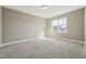 Bright bedroom with plush carpet, ample natural light, and a clean, minimalist aesthetic at 109 Hammermill Dr, Fuquay Varina, NC 27526