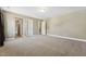 Large bonus room with carpet flooring and access to other rooms at 109 Hammermill Dr, Fuquay Varina, NC 27526