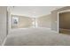 Large bonus room with neutral walls, carpet, and lots of bright natural light at 109 Hammermill Dr, Fuquay Varina, NC 27526