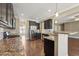 Spacious open kitchen with stainless steel appliances and breakfast bar seating area at 109 Hammermill Dr, Fuquay Varina, NC 27526