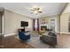 Cozy living room area features a fireplace, hardwood floors, and comfortable seating at 109 Hammermill Dr, Fuquay Varina, NC 27526