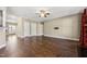 Spacious living room with hardwood floors, ceiling fan and neutral color palette at 109 Hammermill Dr, Fuquay Varina, NC 27526