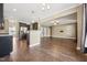 Open concept living room and kitchen space features hardwood floors and bar seating at 109 Hammermill Dr, Fuquay Varina, NC 27526