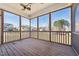 A clear view from screened in porch overlooking an outdoor view, with a ceiling fan at 109 Hammermill Dr, Fuquay Varina, NC 27526