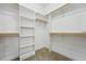 Walk-in closet with custom shelving and carpet flooring at 109 Hammermill Dr, Fuquay Varina, NC 27526
