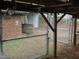 View of the backyard, with a partial structure and gated fence at 110 N 8Th St, Erwin, NC 28339