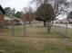 Fenced backyard with mature trees offering shade and privacy at 110 N 8Th St, Erwin, NC 28339
