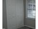 Bedroom closet with a window providing natural light and ventilation at 110 N 8Th St, Erwin, NC 28339