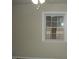 Bedroom featuring neutral walls, ceiling fan, and natural light from a window at 110 N 8Th St, Erwin, NC 28339