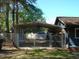 Fenced backyard featuring a large metal carport, providing ample covered parking at 110 N 8Th St, Erwin, NC 28339