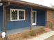Inviting front porch with brick accents and a newly painted exterior at 110 N 8Th St, Erwin, NC 28339