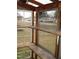 View from inside greenhouse looking toward neighborhood street at 110 N 8Th St, Erwin, NC 28339