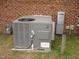 Exterior A/C unit with brick wall at 110 N 8Th St, Erwin, NC 28339