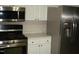 Kitchen featuring stainless steel appliances with white cabinets and countertops at 110 N 8Th St, Erwin, NC 28339