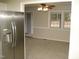 Living room with stainless steel refrigerator visible from the kitchen at 110 N 8Th St, Erwin, NC 28339