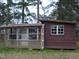 View of storage building with aluminum siding and wood frame with multiple windows at 110 N 8Th St, Erwin, NC 28339