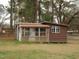 View of storage building with aluminum siding and wood frame with multiple windows at 110 N 8Th St, Erwin, NC 28339