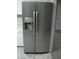 Stainless steel refrigerator with dispenser in a kitchen with gray countertop and cabinets at 110 N 8Th St, Erwin, NC 28339