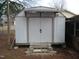 Backyard shed with double doors and concrete steps at 110 N 8Th St, Erwin, NC 28339