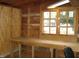 Shed interior featuring a wooden workbench with a large window at 110 N 8Th St, Erwin, NC 28339