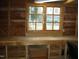 Shed interior featuring a wooden workbench with a large window at 110 N 8Th St, Erwin, NC 28339