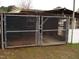 Storage shed with large chain link enclosure at 110 N 8Th St, Erwin, NC 28339