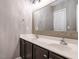 A contemporary bathroom with a double vanity, large framed mirror, and neutral paint at 1113 Crendall Way, Wake Forest, NC 27587
