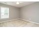 A bright, airy bedroom featuring a ceiling fan and ample natural light from the window at 1113 Crendall Way, Wake Forest, NC 27587