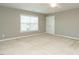 A large bedroom with natural light streaming through the window, a ceiling fan, and double door closet at 1113 Crendall Way, Wake Forest, NC 27587