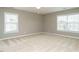 Spacious bedroom with plenty of light, two windows, and a ceiling fan at 1113 Crendall Way, Wake Forest, NC 27587