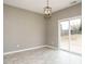 Cozy dining area featuring tile floors and sliding glass doors to the backyard at 1113 Crendall Way, Wake Forest, NC 27587