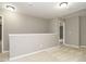 Open and airy landing area with neutral tones and carpet flooring at 1113 Crendall Way, Wake Forest, NC 27587