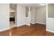 Open-concept living room with hardwood floors and neutral paint colors at 1113 Crendall Way, Wake Forest, NC 27587