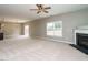 Spacious living room featuring carpet, fireplace, and natural light at 1113 Crendall Way, Wake Forest, NC 27587
