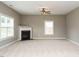 Inviting living room with fireplace, ceiling fan, and bright windows at 1113 Crendall Way, Wake Forest, NC 27587