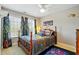 Stylish bedroom with themed bedding, carpet floors, and abundant natural light at 1154 Smith Creek Way, Wake Forest, NC 27587