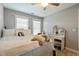 Well-lit bedroom featuring carpet floors, a ceiling fan and natural light at 1154 Smith Creek Way, Wake Forest, NC 27587