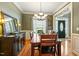 Stylish dining room with hardwood floors and an entryway view of the front door at 1154 Smith Creek Way, Wake Forest, NC 27587