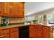 A kitchen boasts granite countertops, stainless steel appliances, and seamless flow to the living areas at 1154 Smith Creek Way, Wake Forest, NC 27587