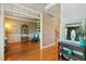 Cozy living room with gleaming hardwood floors, wainscoting and an open-concept design at 1154 Smith Creek Way, Wake Forest, NC 27587