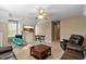 Large room with leather couches, a TV set, a pool table, and a comfy chair at 1154 Smith Creek Way, Wake Forest, NC 27587