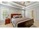 Spacious main bedroom with trey ceilings, natural light, and en-suite bathroom at 1154 Smith Creek Way, Wake Forest, NC 27587