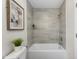 Gray-tiled tub and shower combo in a well-lit bathroom at 1309 N Holland Rd, Fuquay Varina, NC 27526