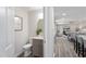 Stylish half bathroom features a modern vanity with gold fixtures and neutral decor at 1309 N Holland Rd, Fuquay Varina, NC 27526
