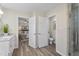 Bathroom leading to the bedroom, featuring a tiled shower with glass door at 1309 N Holland Rd, Fuquay Varina, NC 27526