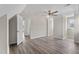 Bright bedroom with wood floors, ceiling fan, and closet at 1309 N Holland Rd, Fuquay Varina, NC 27526