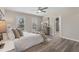 Comfortable bedroom with soft lighting, windows, and space for relaxing in neutral decor at 1309 N Holland Rd, Fuquay Varina, NC 27526
